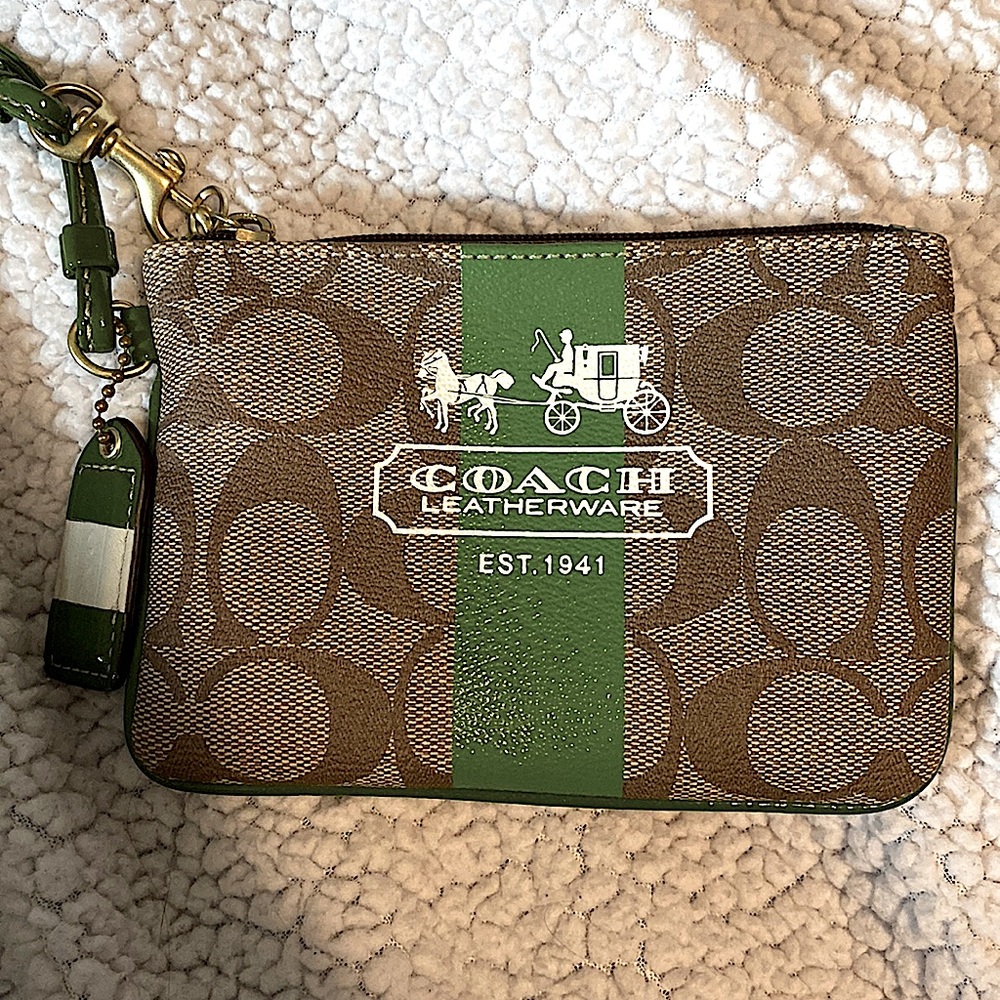 Coach wristlet wallet. Mint condition! Green detailing with plaid interior